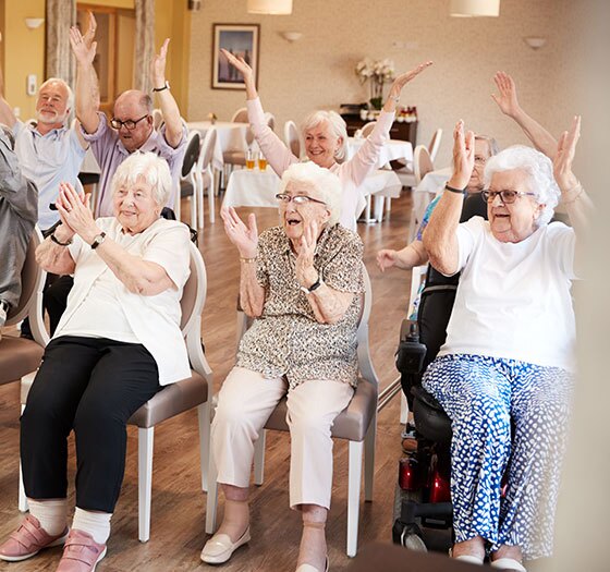 A peaceful senior living community nestled in a scenic valley, showcasing green spaces and cozy homes.